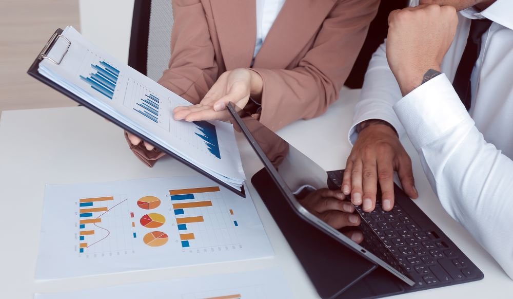 AI Accounting and Tax Services UAE-business-documents-auditor-businesswoman-checking-searching